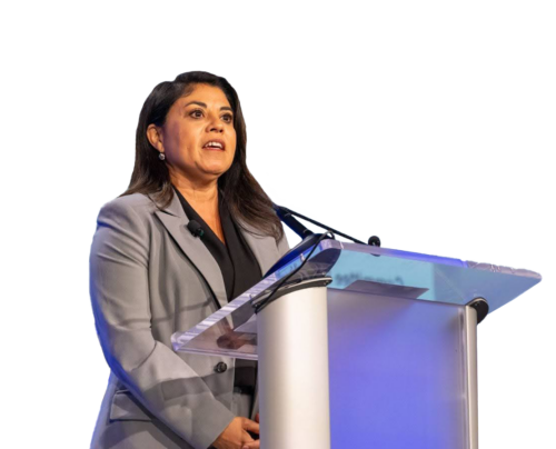 Charmaine S. Morales, RNC speaking into a microphone at a podium.